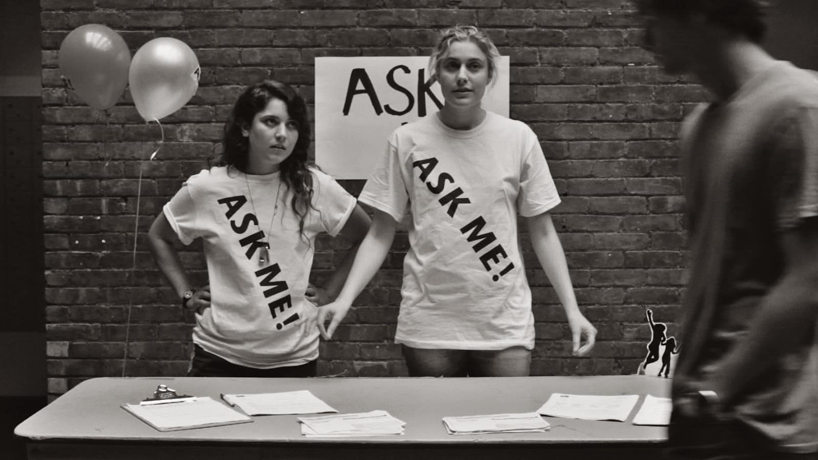 The Most Important Movie In The World: Frances Ha "Greta Gerwig with coworker at university open house wearing "ask me" t-shirt